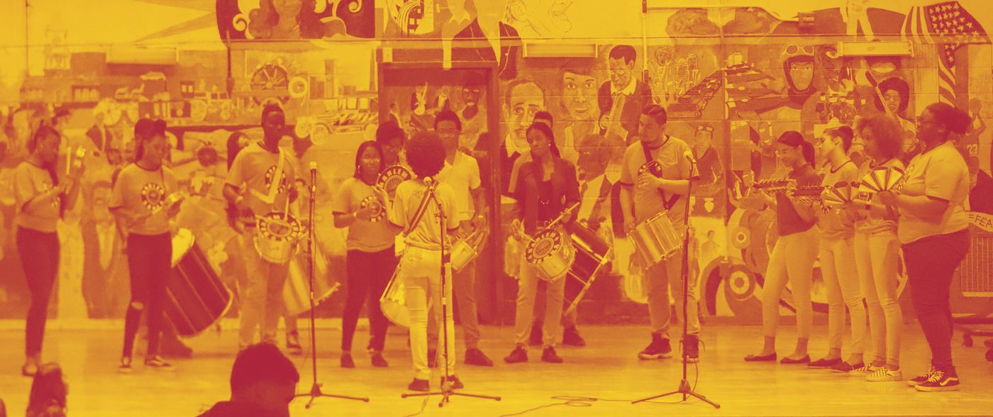 The Harlem Samba percussion ensemble performing in matching costume.