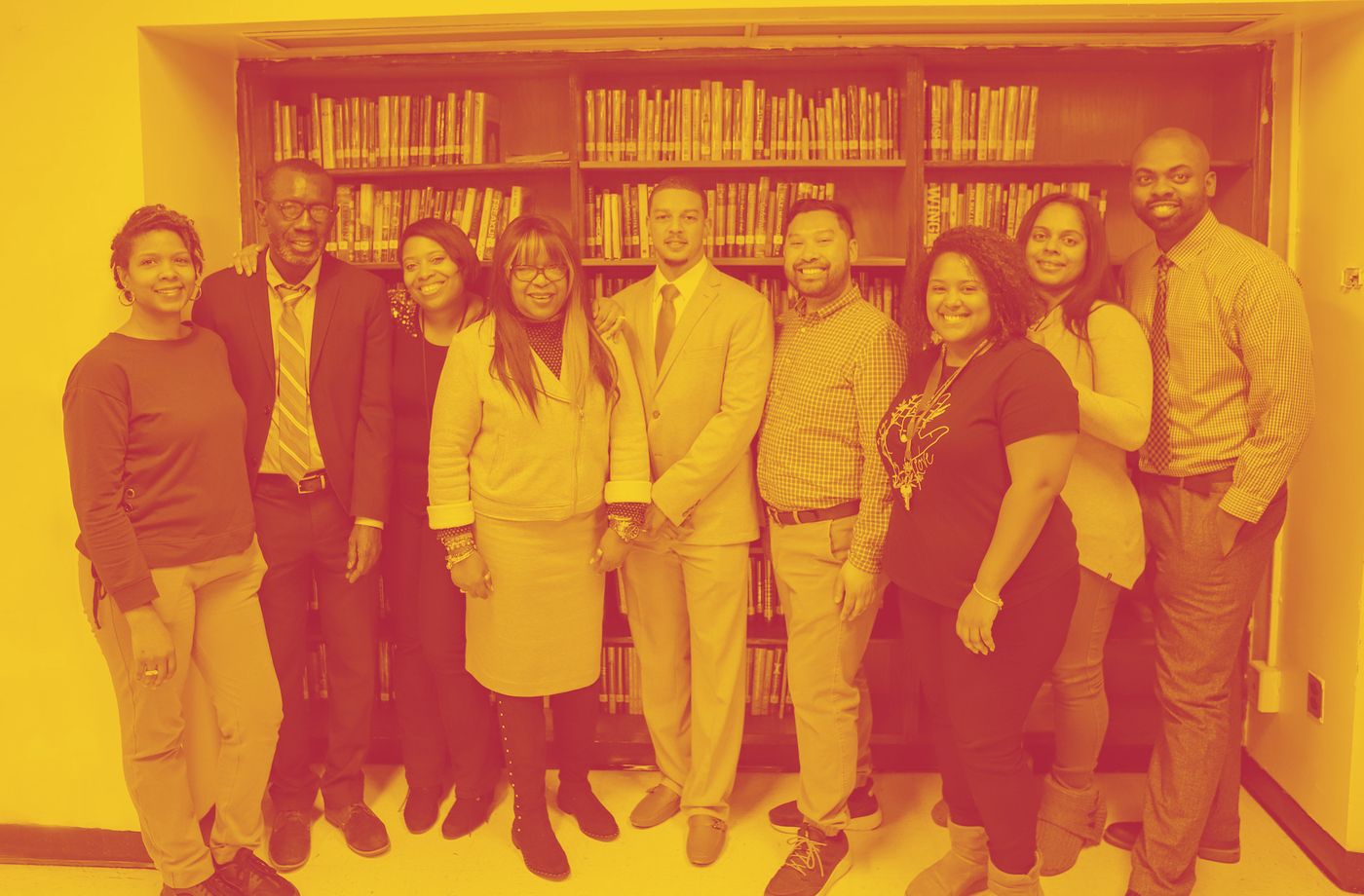 Frederick Douglass Academy faculty and support staff gathered in the school library.